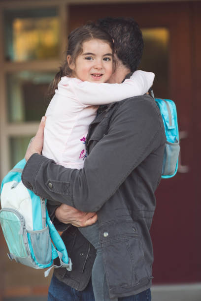 istock Dad drops little girl off at school 1096696246