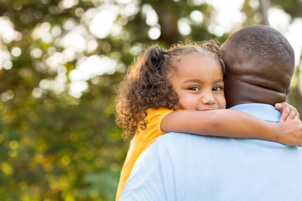 istock Little girl hugging her dad. 1096707318
