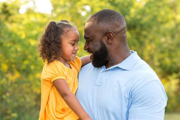 istock Father laughing and playing with his daugher. 1096707356