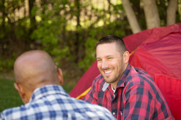 istock Multi-Ethnic group of friends talking and camping 1096711212