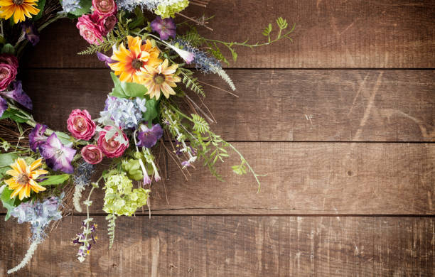 istock Easter spring flower wreath on an old rustic wood background 1096717030