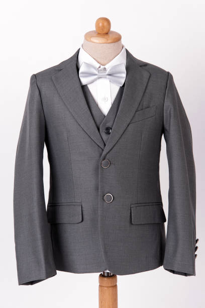 istock Beautiful men's grey jacket suit with shirt and bow tie on white background. 1096717372