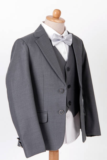istock Beautiful men's grey jacket suit with shirt and bow tie on white background. 1096717498