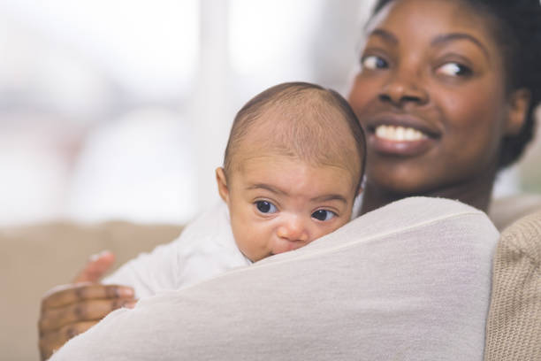 istock Mama holding her newborn baby 1096722756