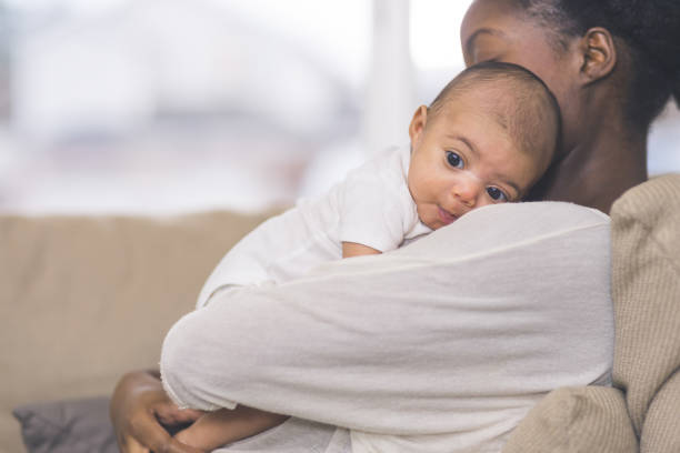 istock Mama holding her newborn baby 1096722766