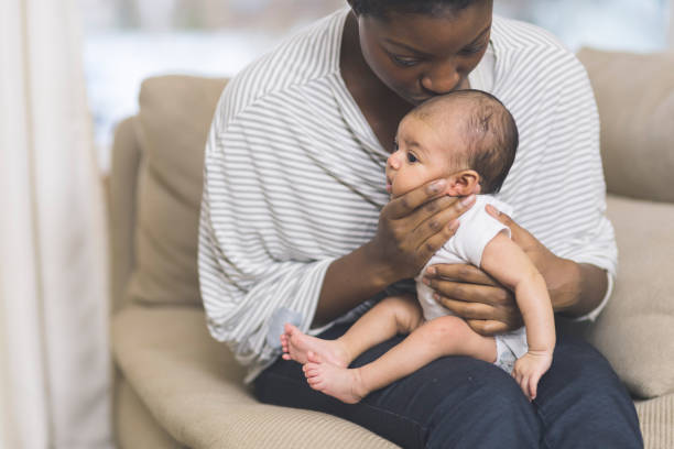 istock Mama holding her newborn baby 1096722774