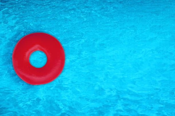 istock Top view inflatable ring swimming in pool background. 1096729144