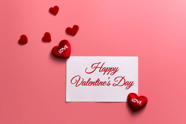 istock Valentine Day concept, red hearts and white note on pink background 1096750910