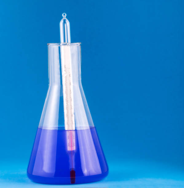 Big laboratory flask with blue liquid