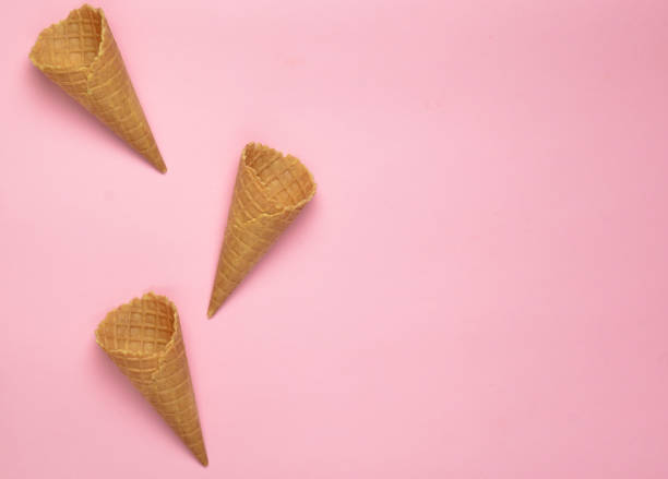 istock Empty waffle horns on a pink background, copy space. Top view, creative background, minimalist trend 1096763396