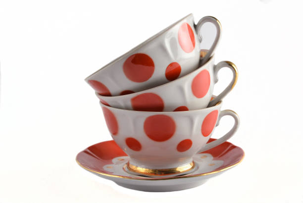 istock stack of antique ceramic cups on a saucer isolated on a white background 1096764690