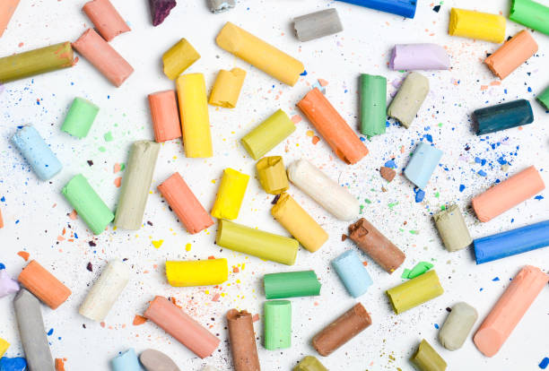 istock Background of many multicolored pastel crayons on a white background, top view 1096765030