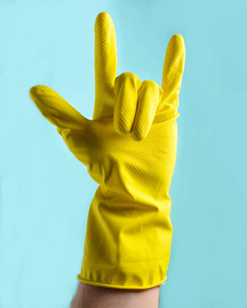 istock hand in yellow rubber gloves 1096765114