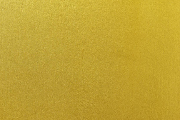 istock Gold paint on rough cement wall texture background 1096769280