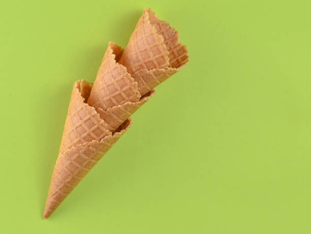 istock Waffle horns on a green  pastel background, creative background, minimalism, top view 1096770958