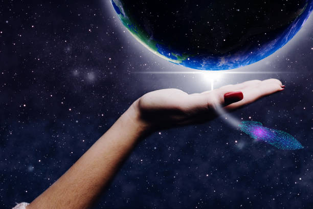 istock Whole world in woman hands palm and spaceship low poly. Mixed media . 1096778986