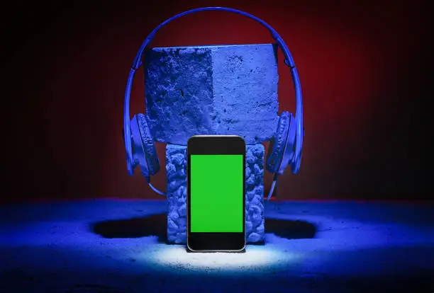 Smartphone with copy space headphones. Art music background concept