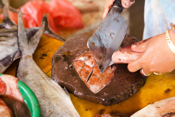 istock The woman cuts the squid. 1096789688