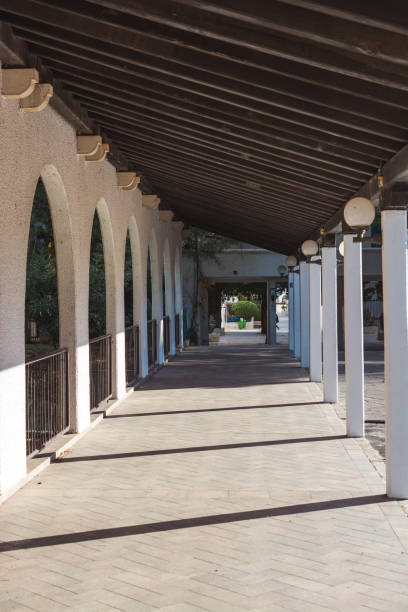 istock Walking path with a roof on sunny day 1096796474