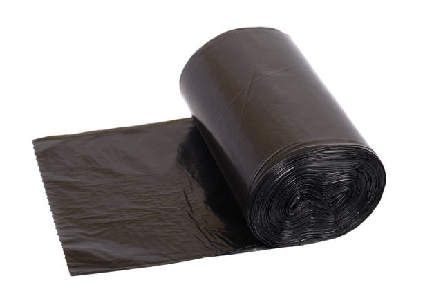 istock roll of black plastic garbage bags for trash 1096796544
