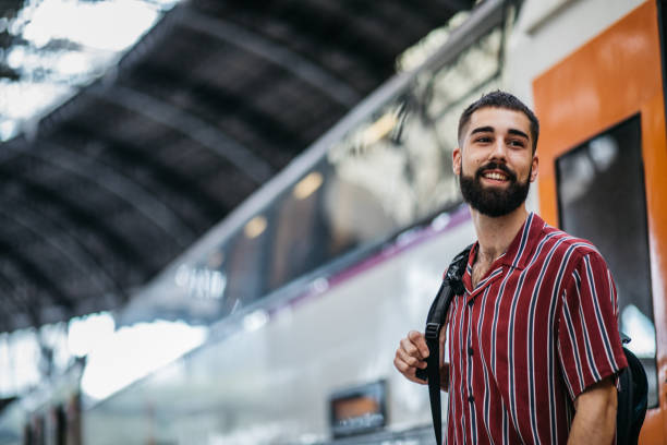istock Man standing on a railroad station platform 1096801714