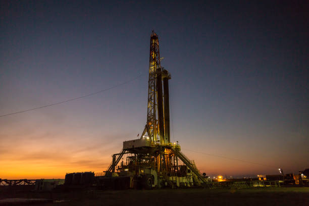 istock Oil drilling rig at dawn 1096806622
