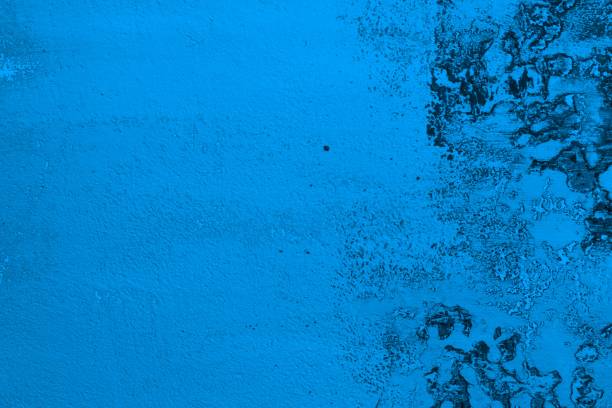 istock light blue huge cracks on messy plaster texture - wonderful abstract photo background 1096807010