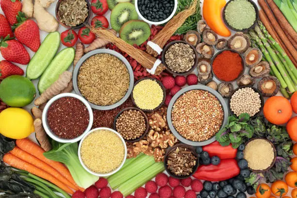 Liver detox super food with fruit, vegetables, herbs, spices, legumes, grains, seeds, herbal medicine and supplement powders. Health foods high in antioxidants, vitamins &  dietary fibre. Top view.