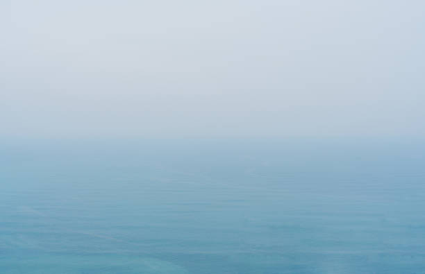 istock Blue sea with mist and overcast sky, mystery environment over ocean 1096810276