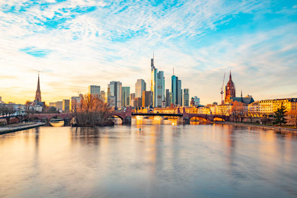 view to frankfurt skyline in sunset view to frankfurt skyline in sunset with river Main frankfurt main stock pictures, royalty-free photos & images