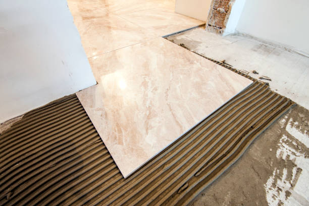 istock Ceramic tiles and tools for tiler. Floor tiles installation. Home improvement, renovation - ceramic tile floor adhesive, mortar, level 1096815154