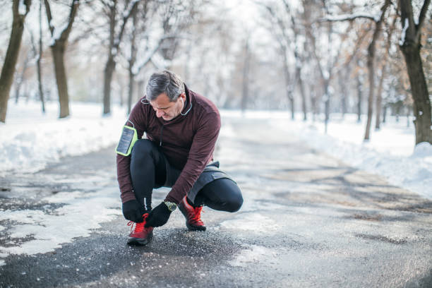 istock Senior man tying shoelace 1096821878