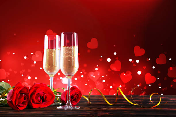 istock Champagne for couple in love in two flutes on table with red tablecloth. 1096826954