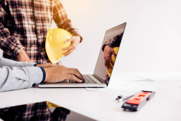 istock Two engineering man working with laptop and discussing project together at the meeting room. 1096835100