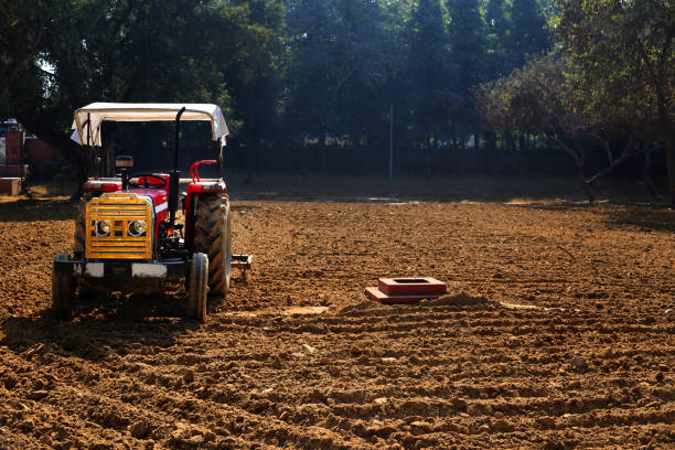 istock Tractor in the ploughed field 1096837620