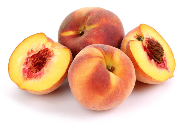 fresh peaches and halved on white background - peach nectarine fruit portion imagens e fotografias de stock