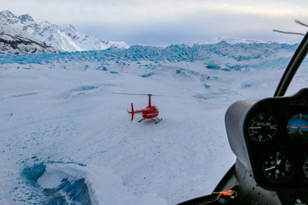 istock Helicopter flying over glacier in alaska 1096846210