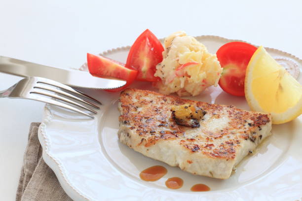 istock sword fish fillet and mango sauteed 1096853746