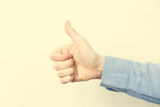 istock Hand In blue shirt with thumb up. Toned. 1096865668