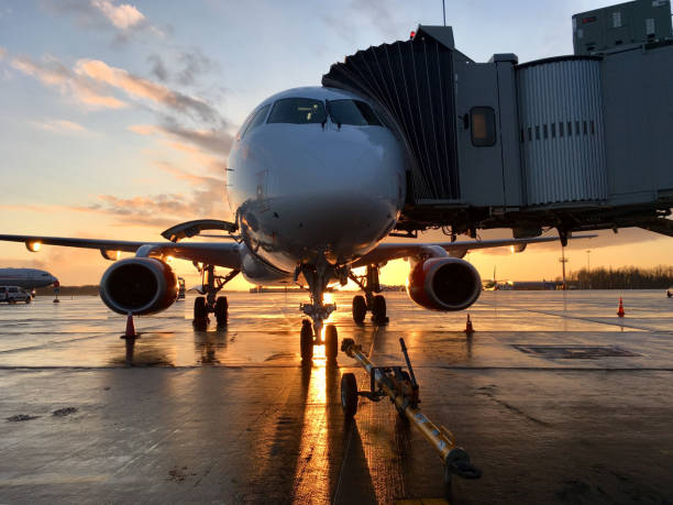 istock Airplane on the parking lot at sunset 1096866618
