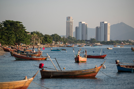 fishing boats at the Bang Saen Beach at the Town of Bangsaen in the Provinz Chonburi in Thailand.  Thailand, Bangsaen, November, 2018