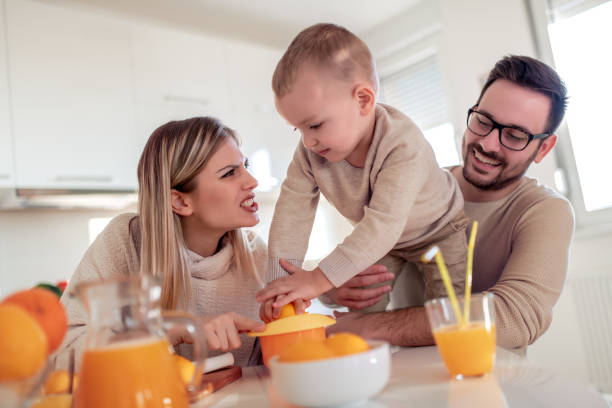 istock Family make and drink fresh orange juice 1096871978