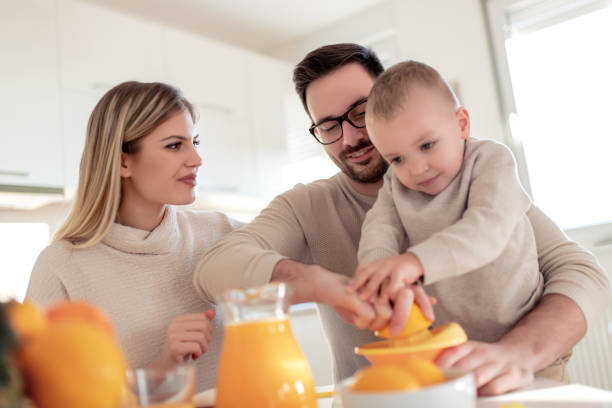 istock Family make and drink fresh orange juice 1096872058