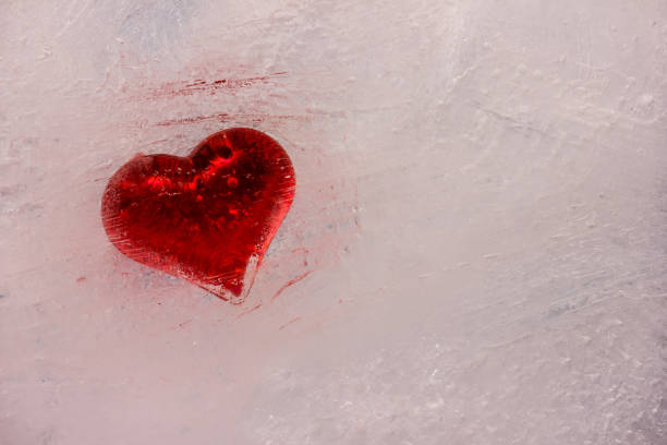 istock Still life red heart frozen in white ice 1096881588