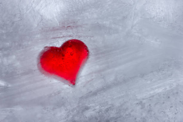 istock Still life red heart frozen in white ice 1096881610