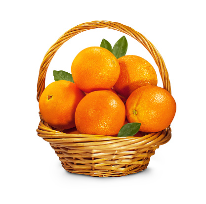 basket with oranges on white isolated background