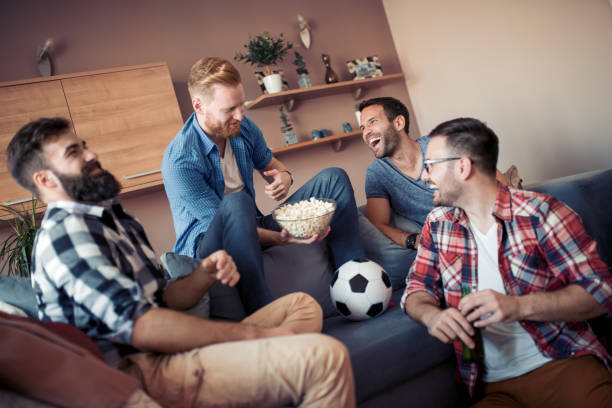 istock Friends watching soccer game 1096889800