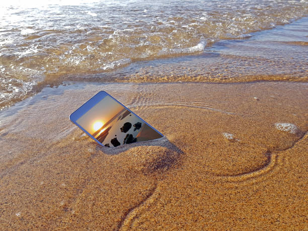 Mobile phone dropped into the water from the ocean