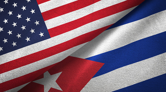 Cuba and United States flags together textile cloth, fabric texture