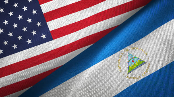 Nicaragua and United States two flags together textile cloth, fabric texture Nicaragua and United States flags together textile cloth, fabric texture nicaragua stock pictures, royalty-free photos & images
